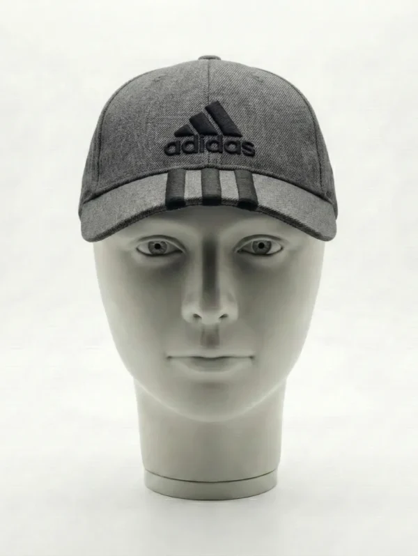 The Adidas Grey Cap with Logo and Stripes is a classic sportswear accessory rooted in Adidas’ iconic design language.