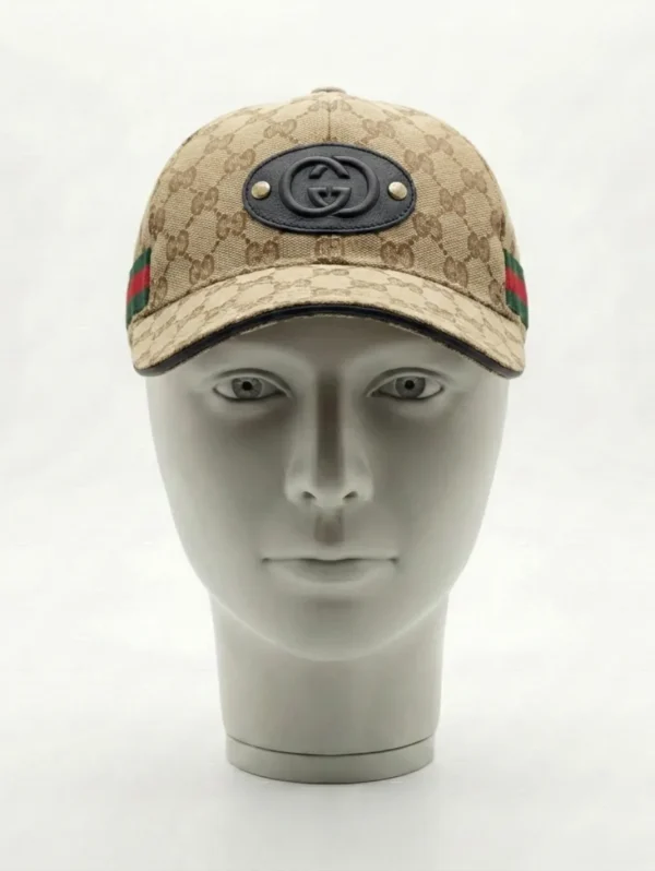 The Gucci Cap with Classic Pattern and Logo Emblem is a statement accessory inspired by luxury fashion aesthetics.