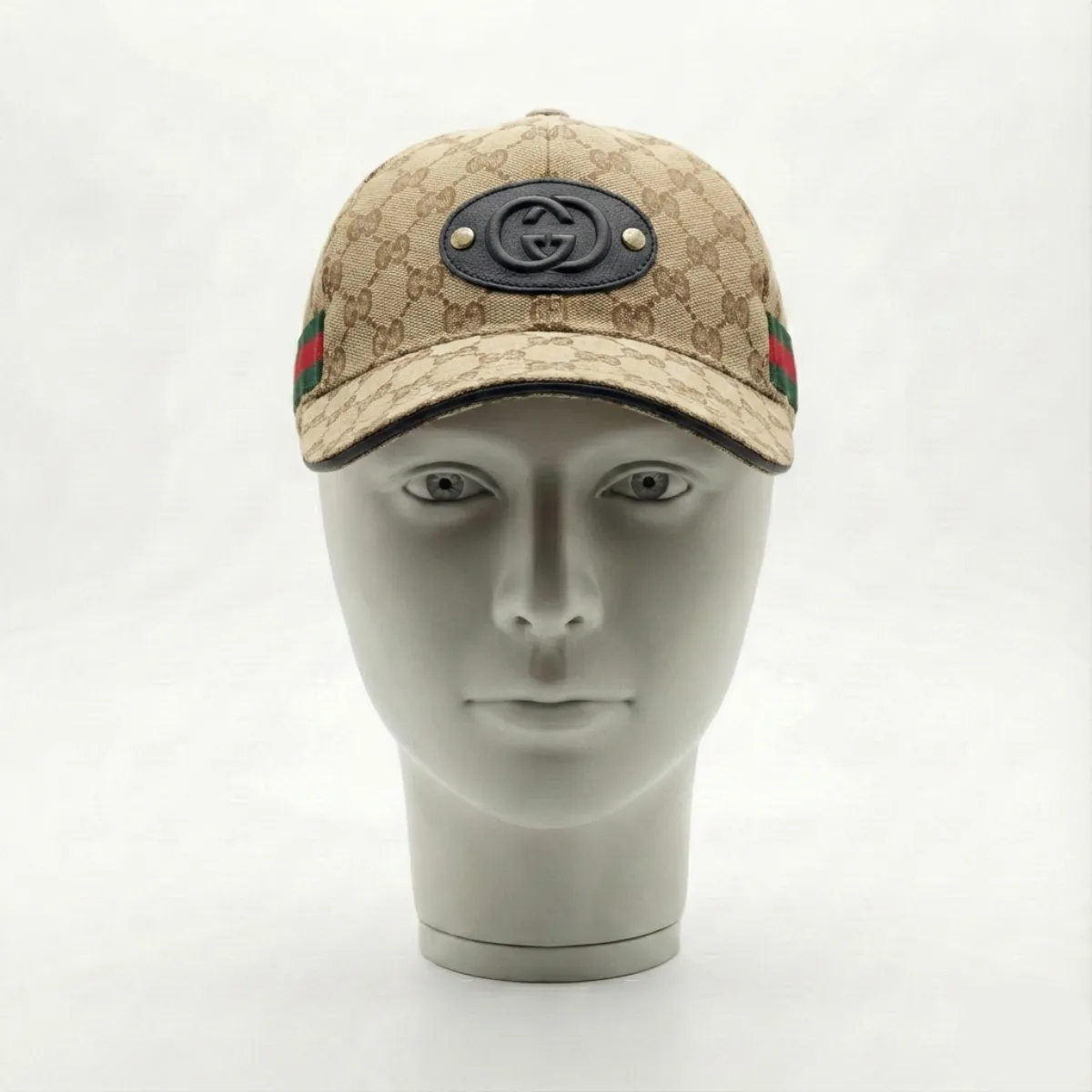 The Gucci Cap with Classic Pattern and Logo Emblem is a statement accessory inspired by luxury fashion aesthetics.